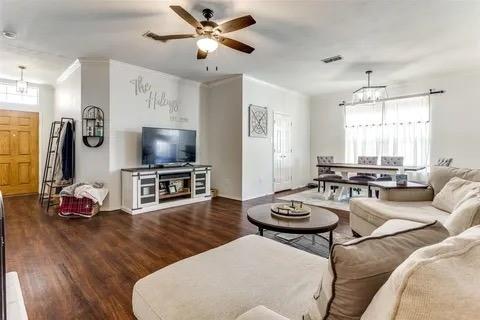 125 Timber Cross Court Azle, TX 76020 - Photo 12 of 17 a living room with furniture a flat screen tv and a window