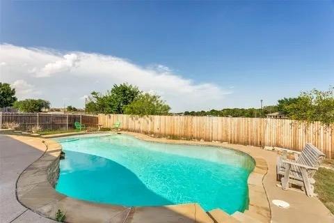 125 Timber Cross Court Azle, TX 76020 - Photo 13 of 17 a view of a backyard with a lake view