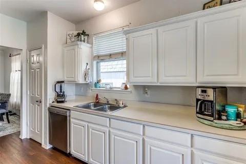 125 Timber Cross Court Azle, TX 76020 - Photo 3 of 17 a kitchen with stainless steel appliances granite countertop white cabinets and a stove