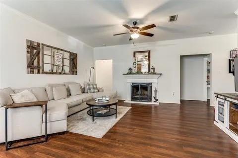 125 Timber Cross Court Azle, TX 76020 - Photo 5 of 17 a living room with furniture and a fireplace