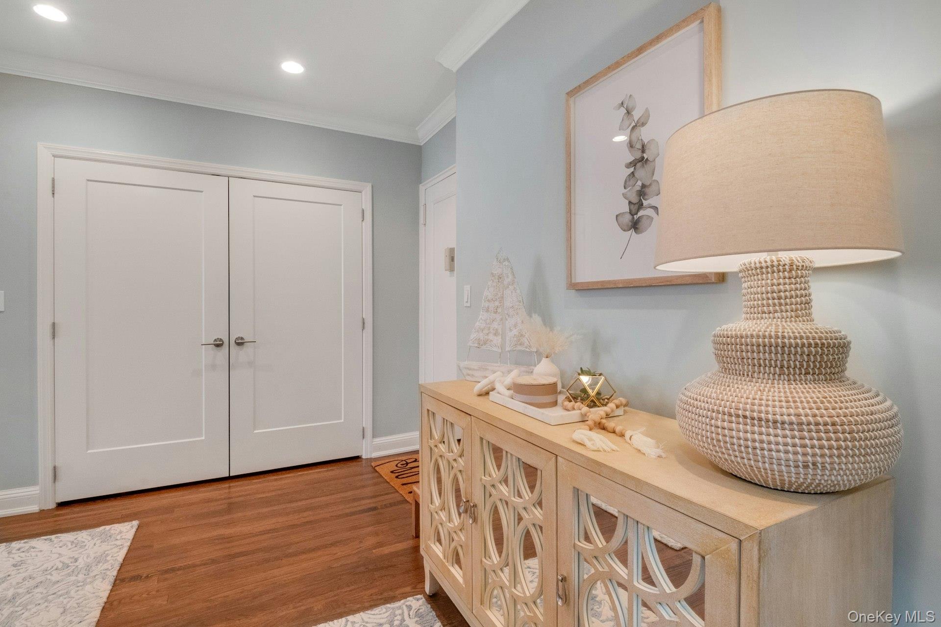 101 Old Mamaroneck Road, Unit 2C5 White Plains, NY 10605 - Photo 7 of 35 a bedroom with furniture and a wooden floor