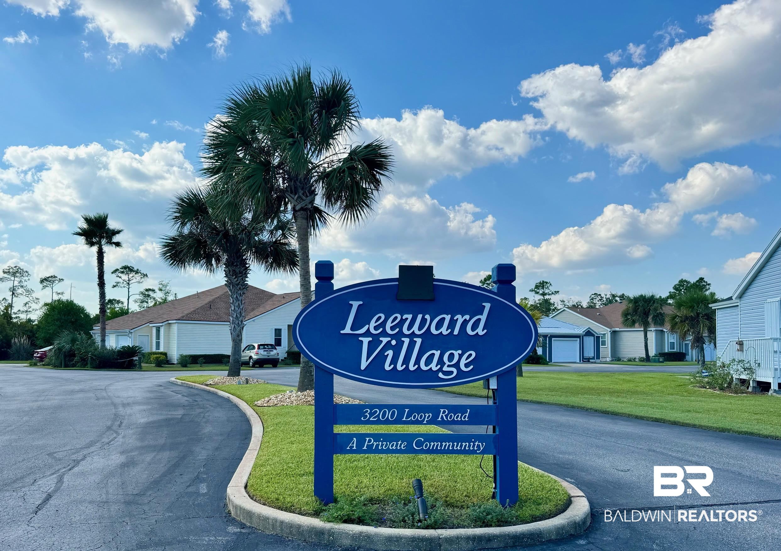 Community sign featuring a lawn
