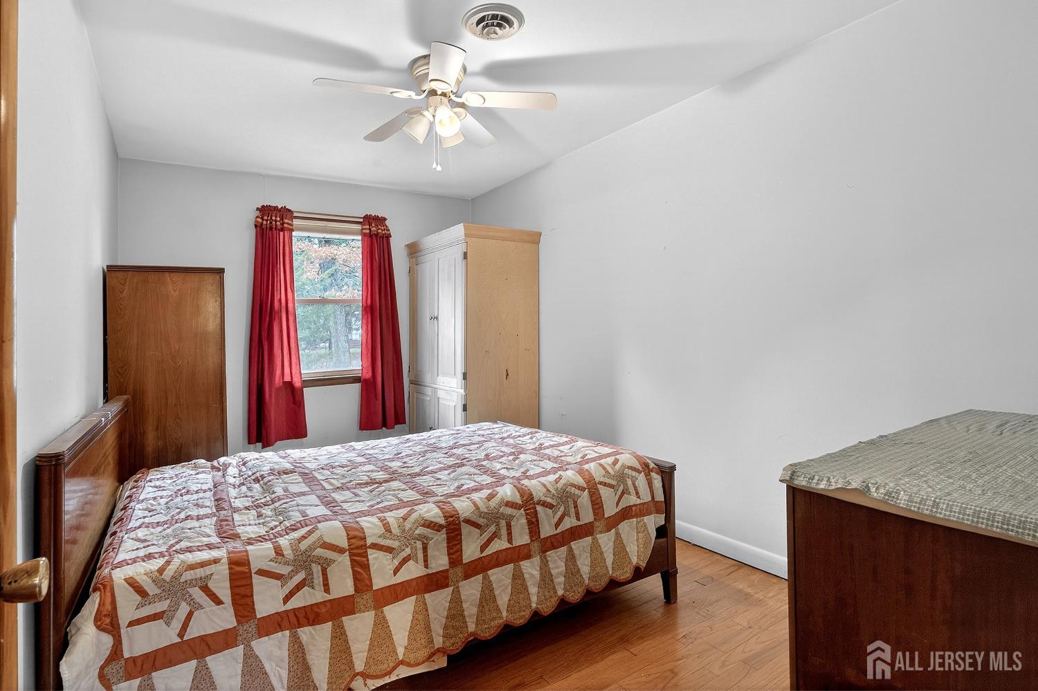 21 Pine Street Old Bridge, NJ 08857 - Photo 19 of 31 a bedroom with a bed dresser and a window