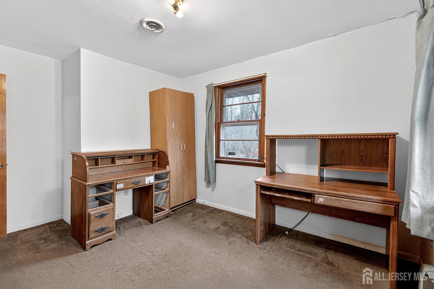 21 Pine Street Old Bridge, NJ 08857 - Photo 21 of 31 a bedroom with furniture and a window