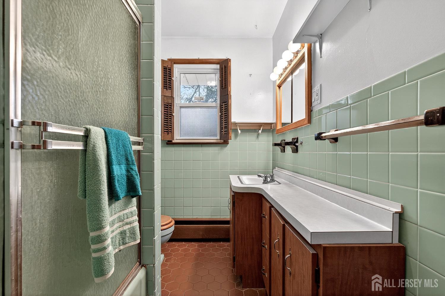 21 Pine Street Old Bridge, NJ 08857 - Photo 24 of 31 a bathroom with a sink a toilet and mirror