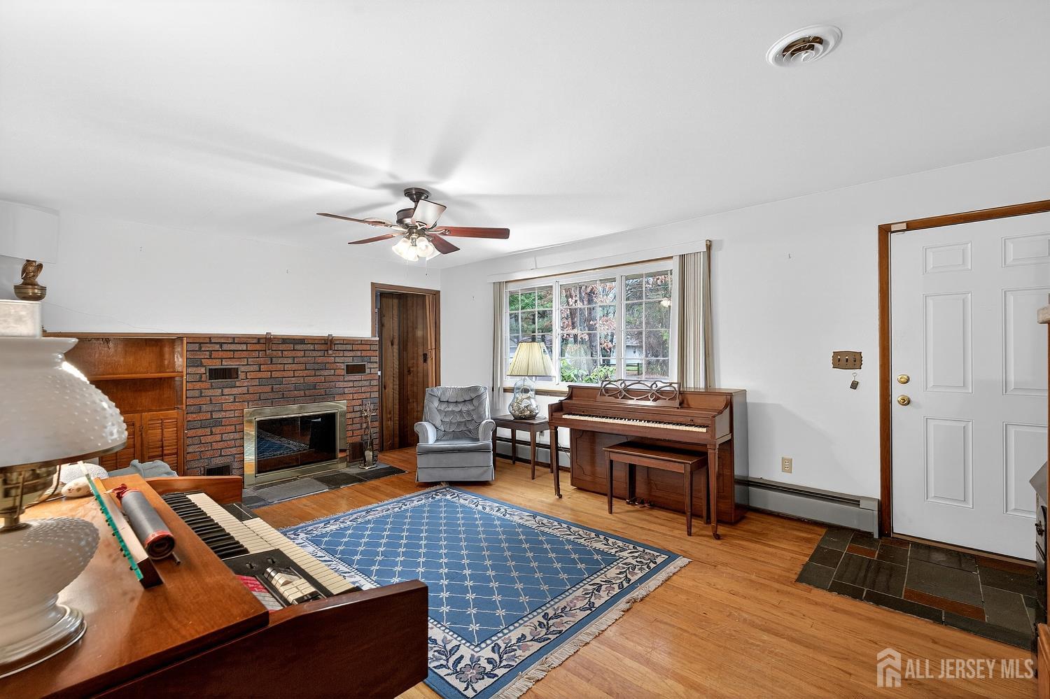 21 Pine Street Old Bridge, NJ 08857 - Photo 5 of 31 a living room with furniture and a fireplace