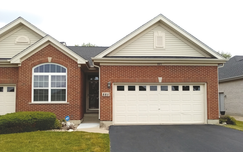 a view of house with yard