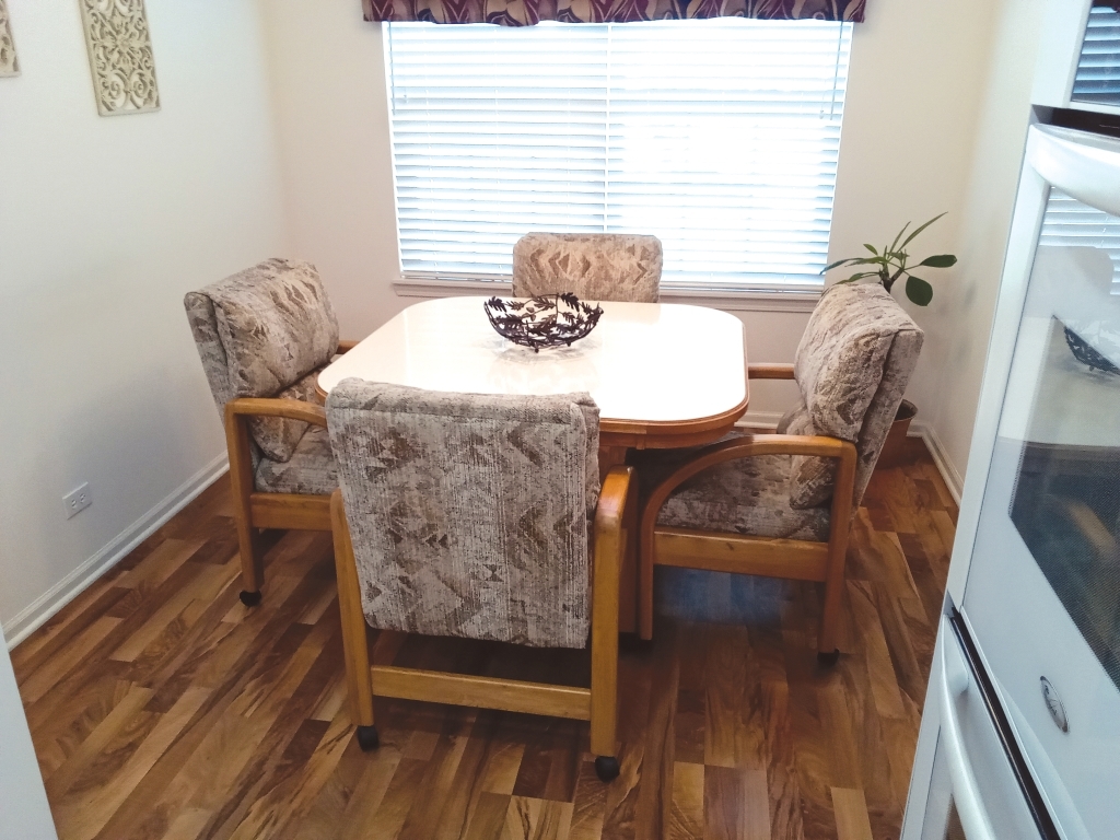 885 Eineke Boulevard Algonquin, IL 60102 - Photo 9 of 16 a dining room with furniture and wooden floor