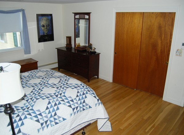 17 Faulkner Hill Road Acton, MA 01720 - Photo 11 of 25 a bedroom with a bed and a dresser