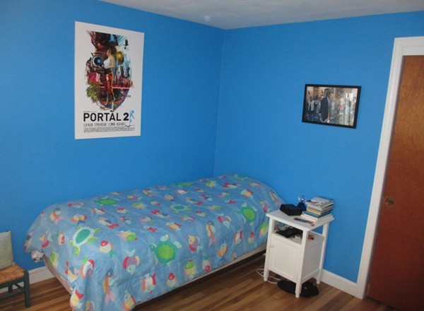 17 Faulkner Hill Road Acton, MA 01720 - Photo 12 of 25 a bedroom with a bed and a table in it