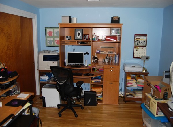 17 Faulkner Hill Road Acton, MA 01720 - Photo 14 of 25 a view of a workspace with furniture and a fireplace