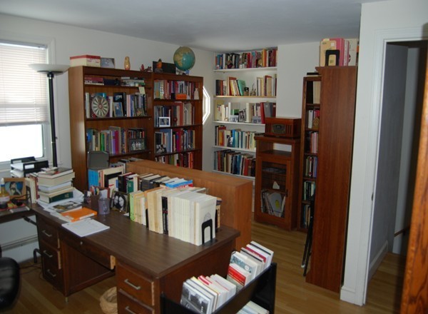 17 Faulkner Hill Road Acton, MA 01720 - Photo 15 of 25 a view of a workspace with furniture and a bookshelf