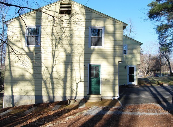 17 Faulkner Hill Road Acton, MA 01720 - Photo 24 of 25 a view of a large brick house with many windows