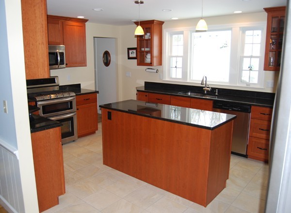 17 Faulkner Hill Road Acton, MA 01720 - Photo 3 of 25 a kitchen with stainless steel appliances granite countertop a sink and a stove