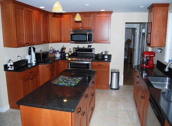 17 Faulkner Hill Road Acton, MA 01720 - Photo 4 of 25 a kitchen with stainless steel appliances granite countertop a sink stove and refrigerator