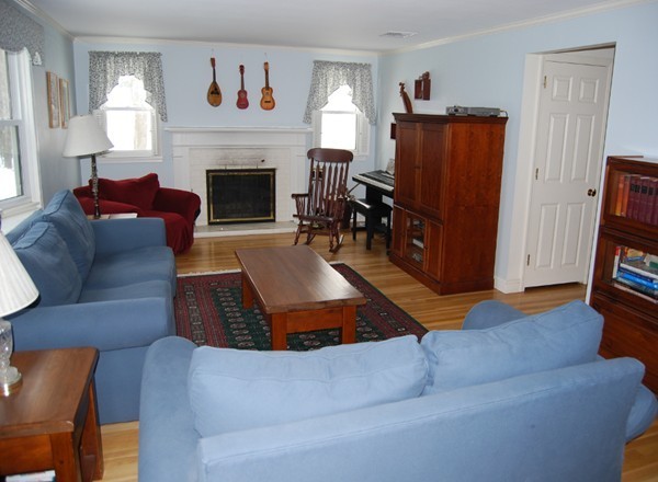 17 Faulkner Hill Road Acton, MA 01720 - Photo 6 of 25 a living room with furniture and a fireplace