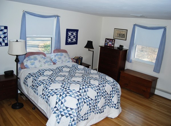 17 Faulkner Hill Road Acton, MA 01720 - Photo 10 of 25 a bedroom with bed and wooden floor