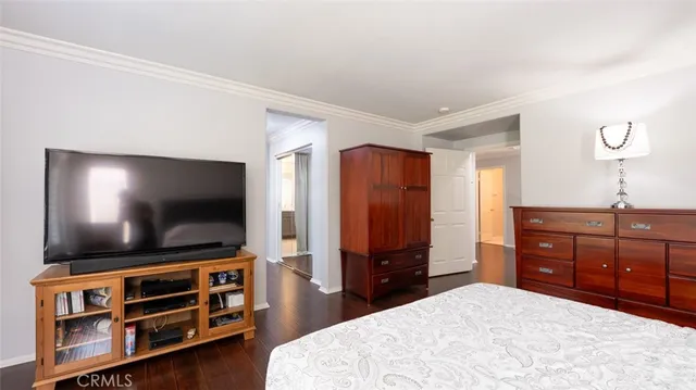 a view of an entryway with wooden floor and a livingroom