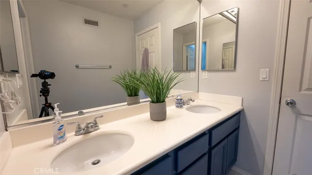 a bedroom with a bed and a table in it