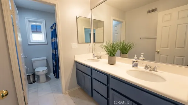 a bedroom with a bed and a window in it