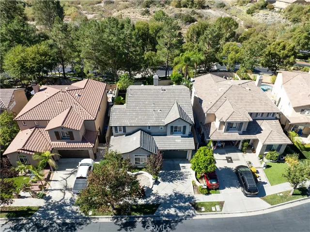 an aerial view of a houses with yard