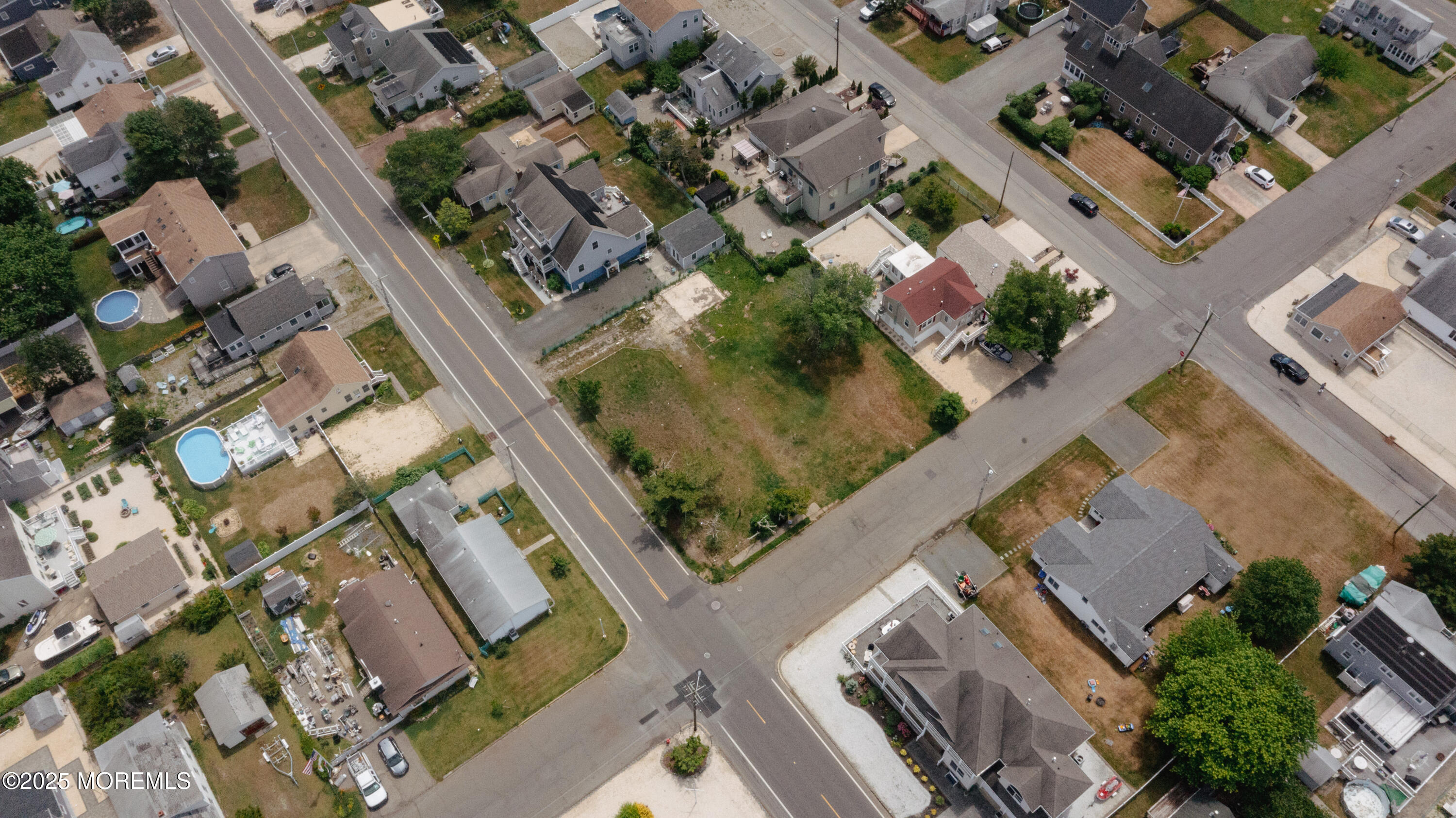409 Newport Avenue Ocean Gate, NJ 08740 - Photo 17 of 22 an aerial view of residential houses with outdoor space