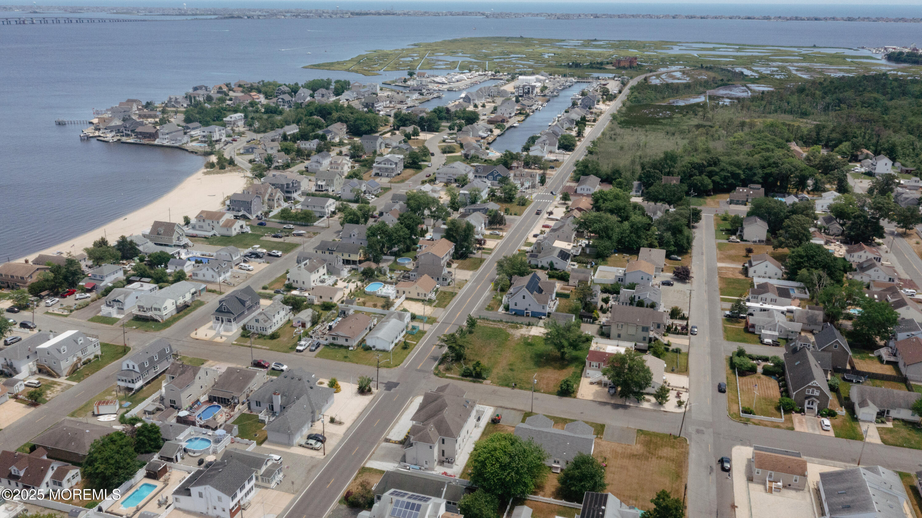 409 Newport Avenue Ocean Gate, NJ 08740 - Photo 2 of 22 an aerial view of a city with lots of residential buildings