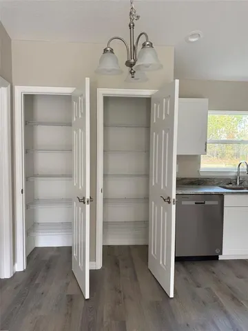 a kitchen with a refrigerator and a sink