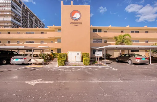 a view of a cars park in front of building