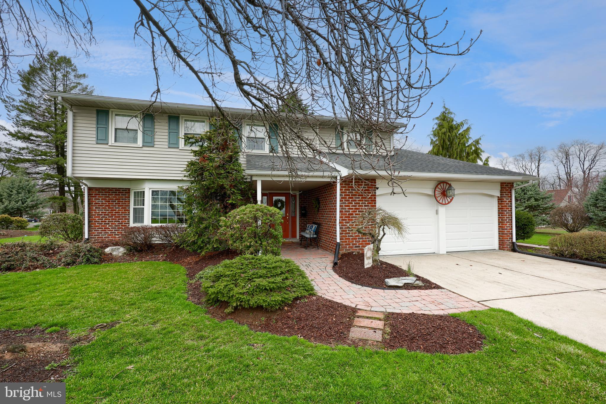 701 Colony Drive Palmyra, PA 17078 - Photo 1 of 51 a front view of a house with a garden and yard