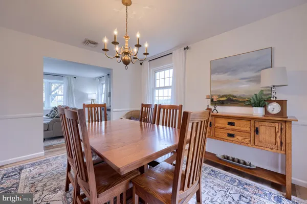 a view of a dining room with furniture window and chandelier