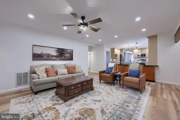a room with windows and ceiling fan