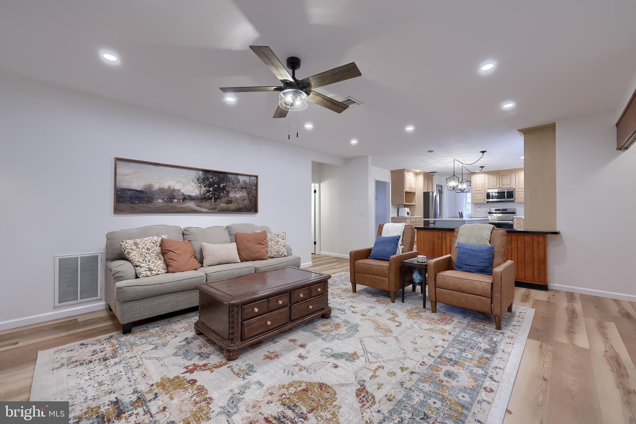 701 Colony Drive Palmyra, PA 17078 - Photo 25 of 51 a living room with furniture and a chandelier