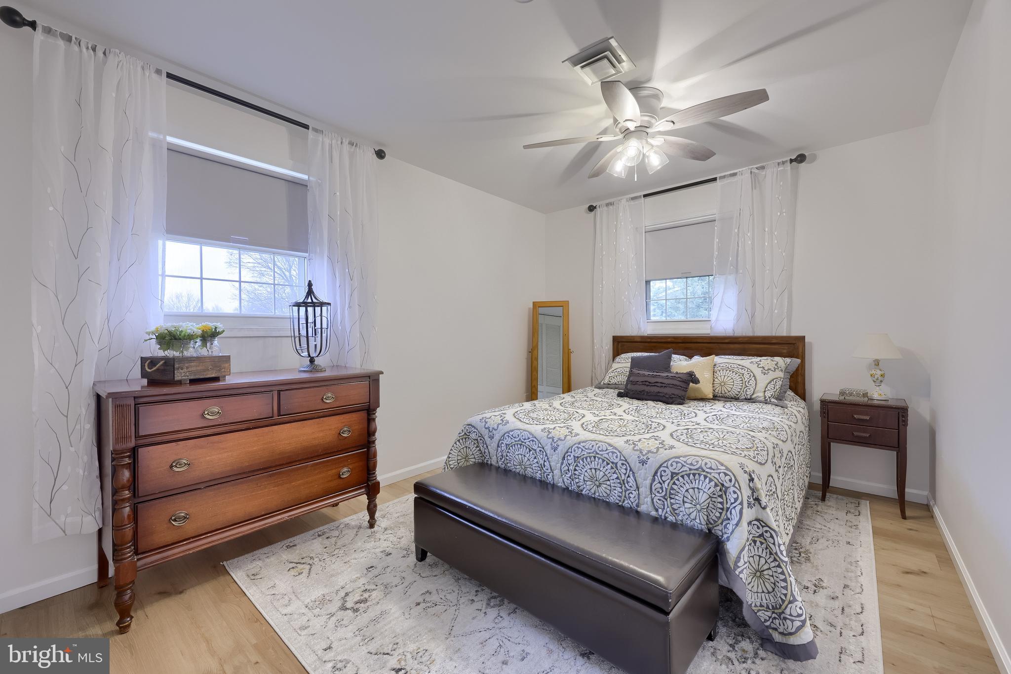 701 Colony Drive Palmyra, PA 17078 - Photo 42 of 51 a bedroom with a bed and a chandelier