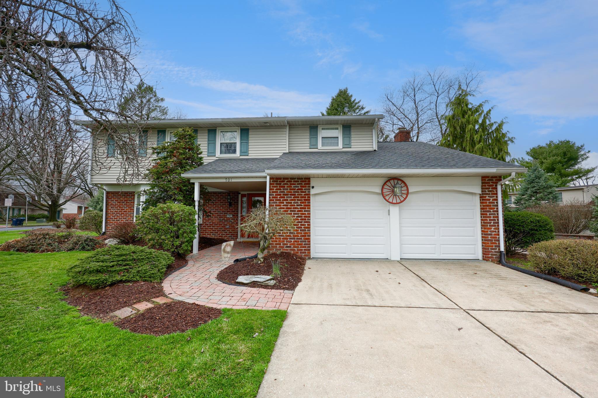 701 Colony Drive Palmyra, PA 17078 - Photo 45 of 51 a front view of a house with a yard and garage