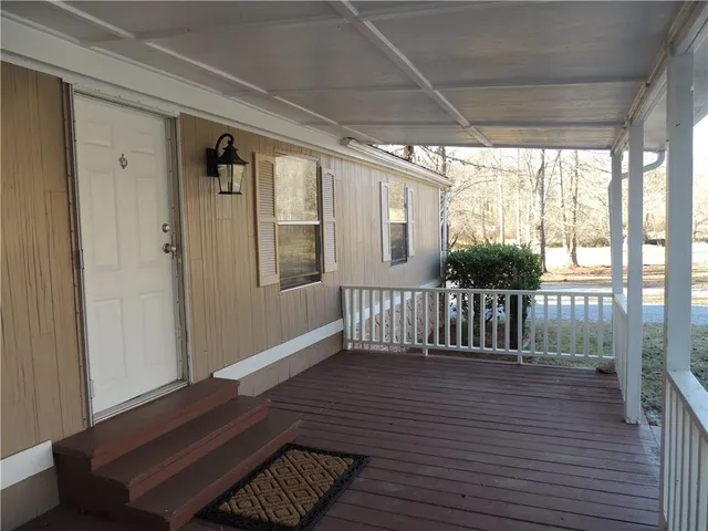 a living room with a fireplace and a window