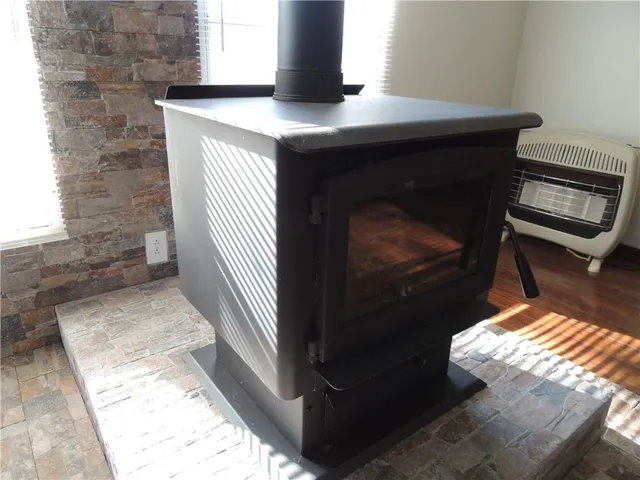 a kitchen with a stove and a refrigerator