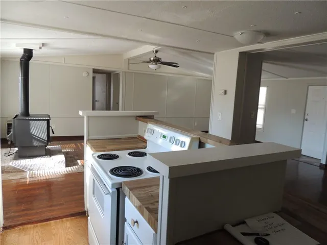 a view of a kitchen with a sink and cabinet
