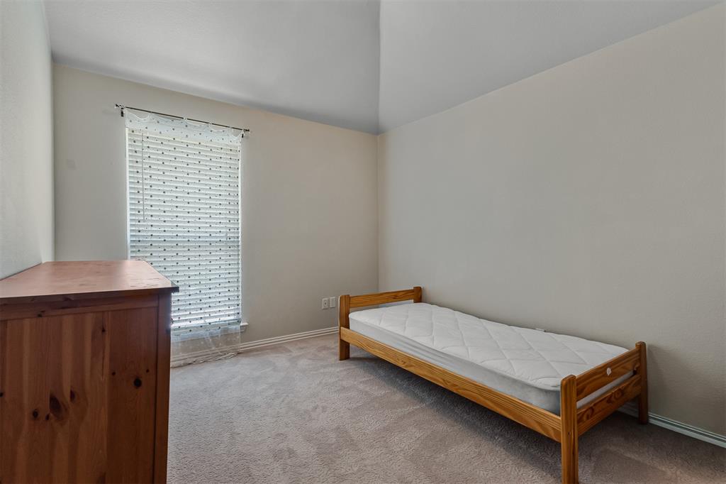 9301 Nottingham Court Rowlett, TX 75088 - Photo 21 of 39 Carpeted room with a single window featuring blinds and sheer curtains