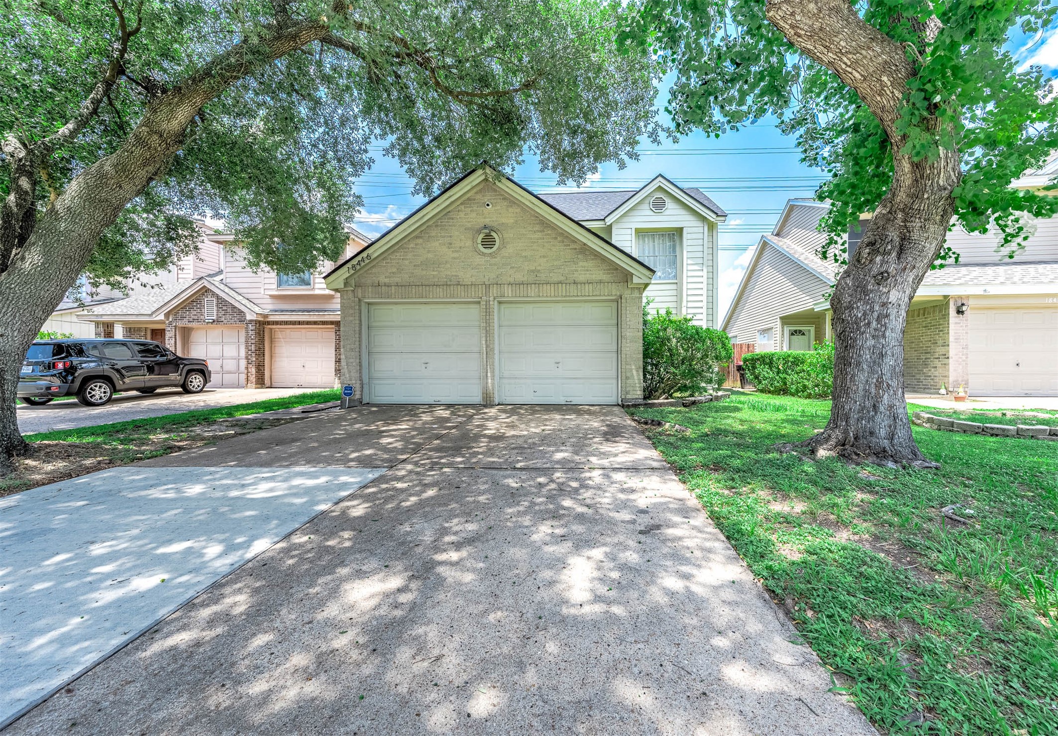 18446 North Willow Bluff Road Katy, TX 77449 - Photo 2 of 31 a front view of a house with yard and tree