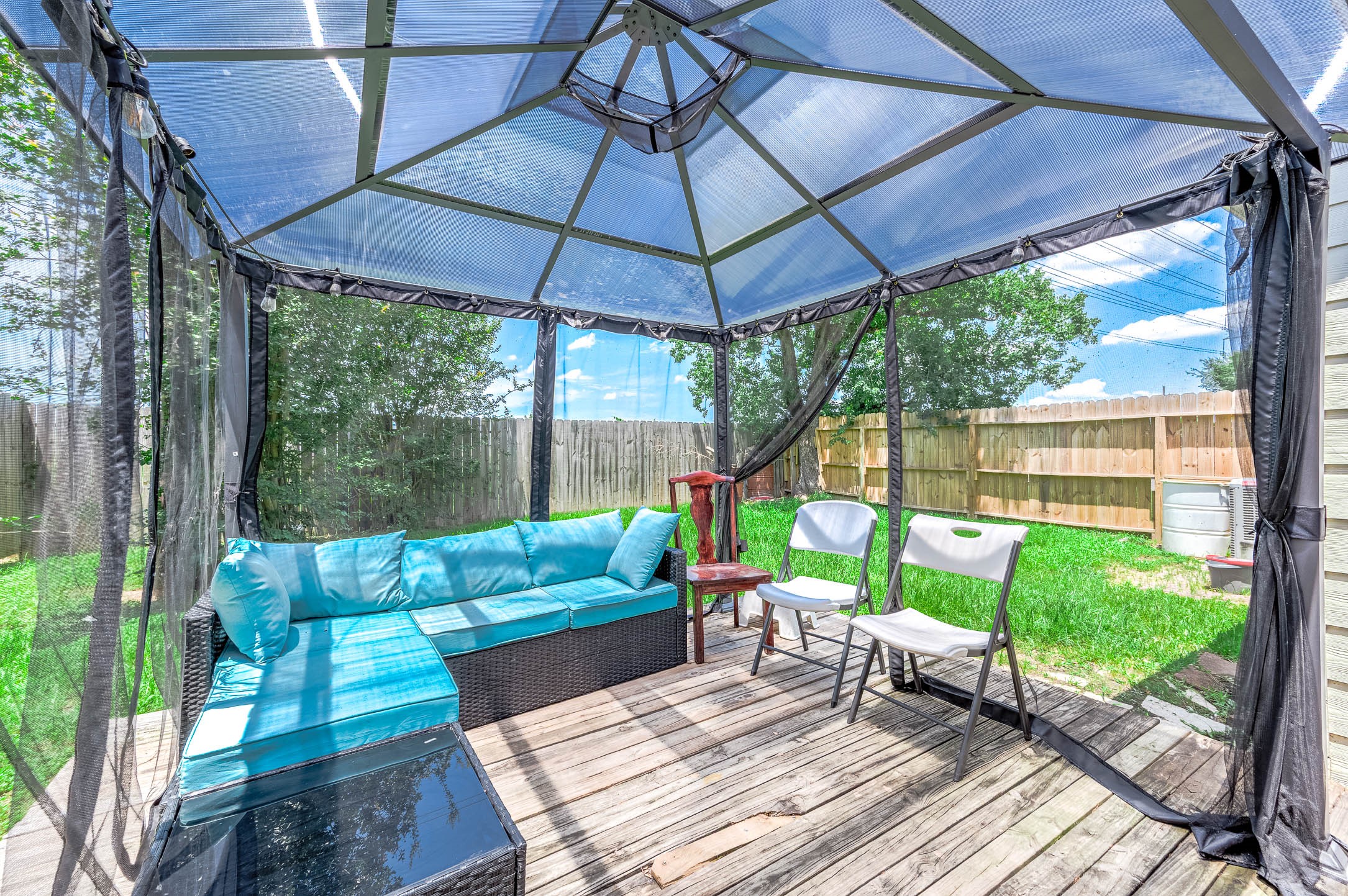 18446 North Willow Bluff Road Katy, TX 77449 - Photo 31 of 31 a view of a chair and tables in the patio