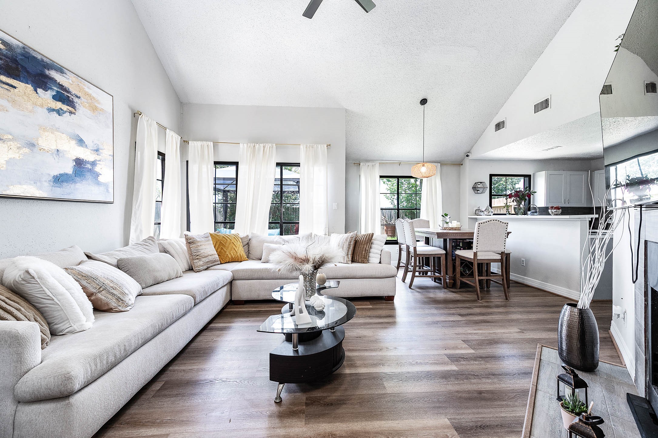 18446 North Willow Bluff Road Katy, TX 77449 - Photo 7 of 31 a living room with furniture or couch and a dining table