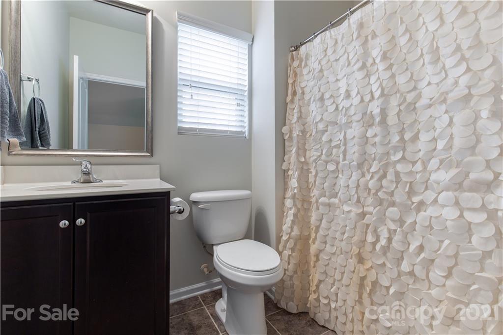 1556 Spring Blossom Trail Fort Mill, SC 29708 - Photo 11 of 22 a bathroom with a sink and a toilet