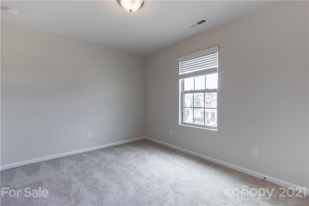 1556 Spring Blossom Trail Fort Mill, SC 29708 - Photo 16 of 22 an empty room with a window