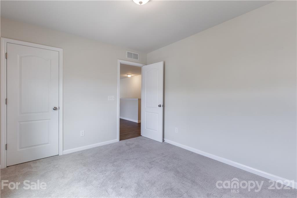 1556 Spring Blossom Trail Fort Mill, SC 29708 - Photo 17 of 22 a view of an empty room