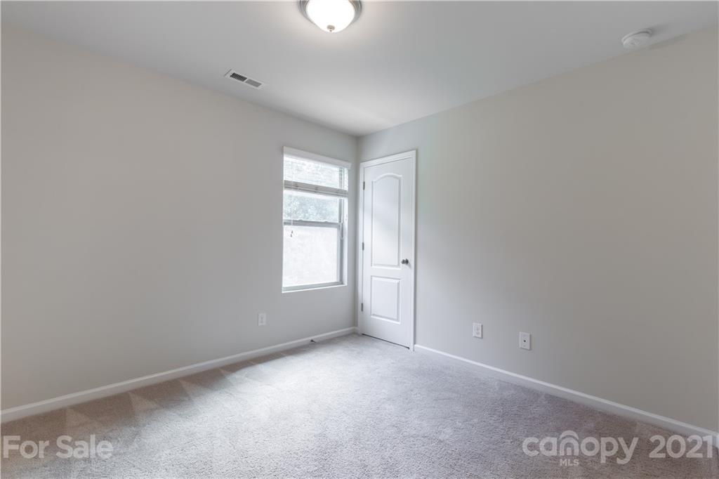 1556 Spring Blossom Trail Fort Mill, SC 29708 - Photo 20 of 22 an empty room with windows