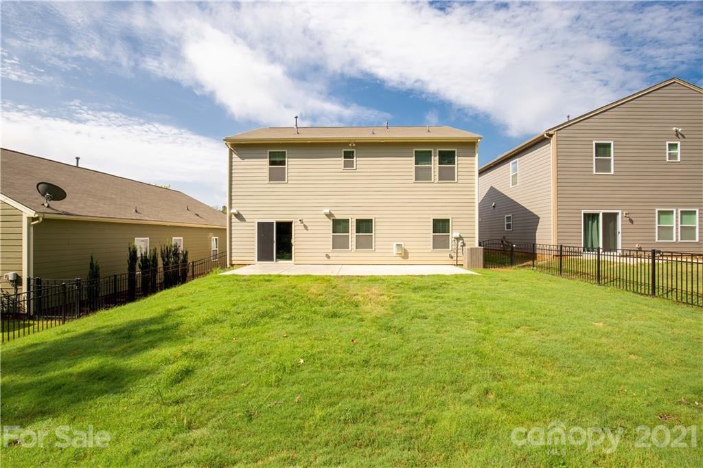 1556 Spring Blossom Trail Fort Mill, SC 29708 - Photo 21 of 22 a view of a house with backyard
