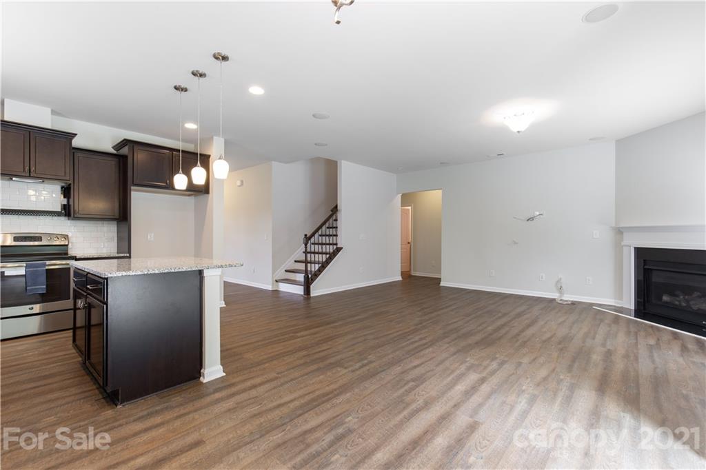 1556 Spring Blossom Trail Fort Mill, SC 29708 - Photo 5 of 22 a view of kitchen with furniture and wooden floor