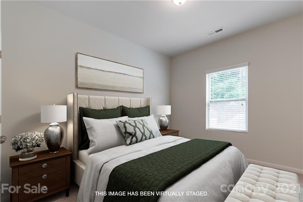 1556 Spring Blossom Trail Fort Mill, SC 29708 - Photo 9 of 22 a bedroom with a bed and window