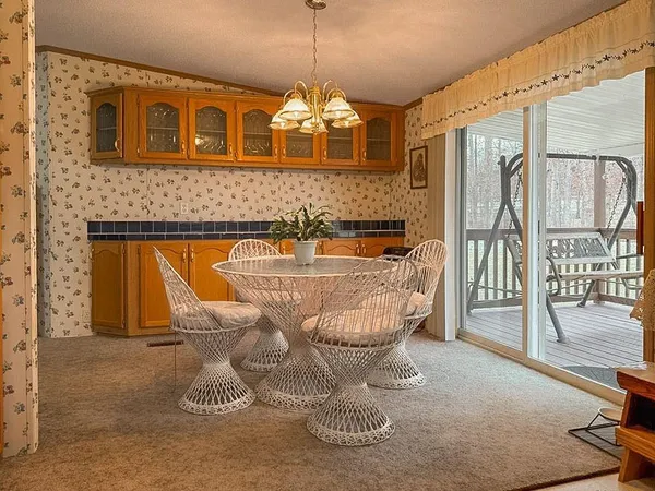 a very nice looking dining room with a table and chairs